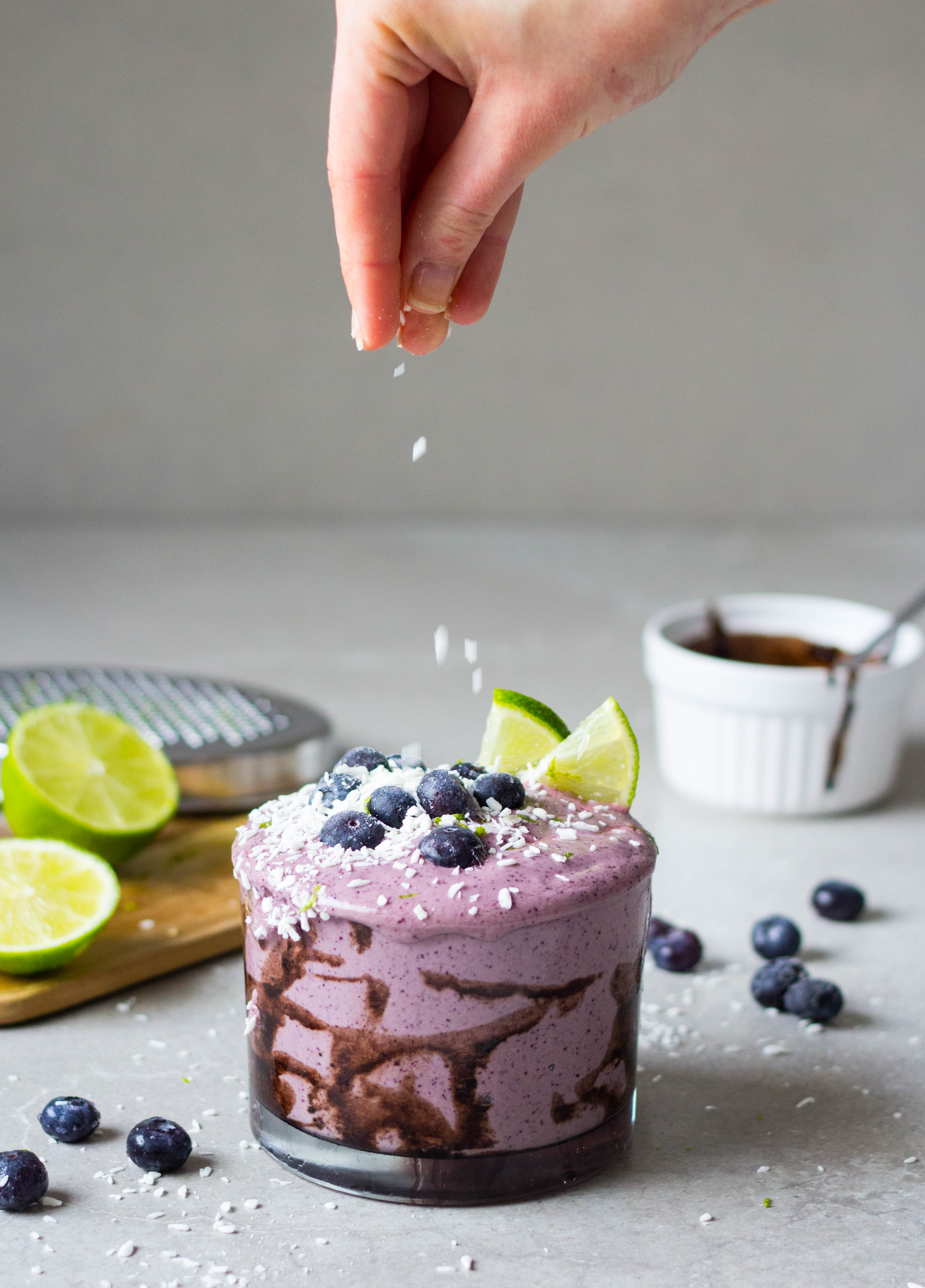 a jar of blueberry walnut whip with carob sauce lime coconut blueberries parfait acai